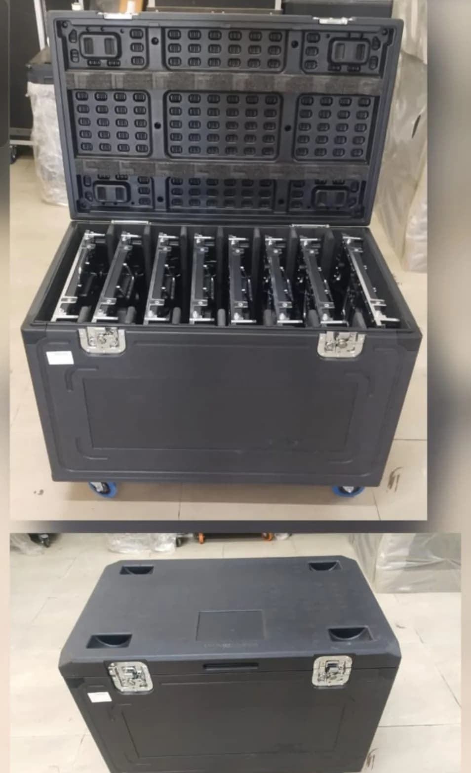 Open flight case holding eight LED cabinets, with a second closed flight case below